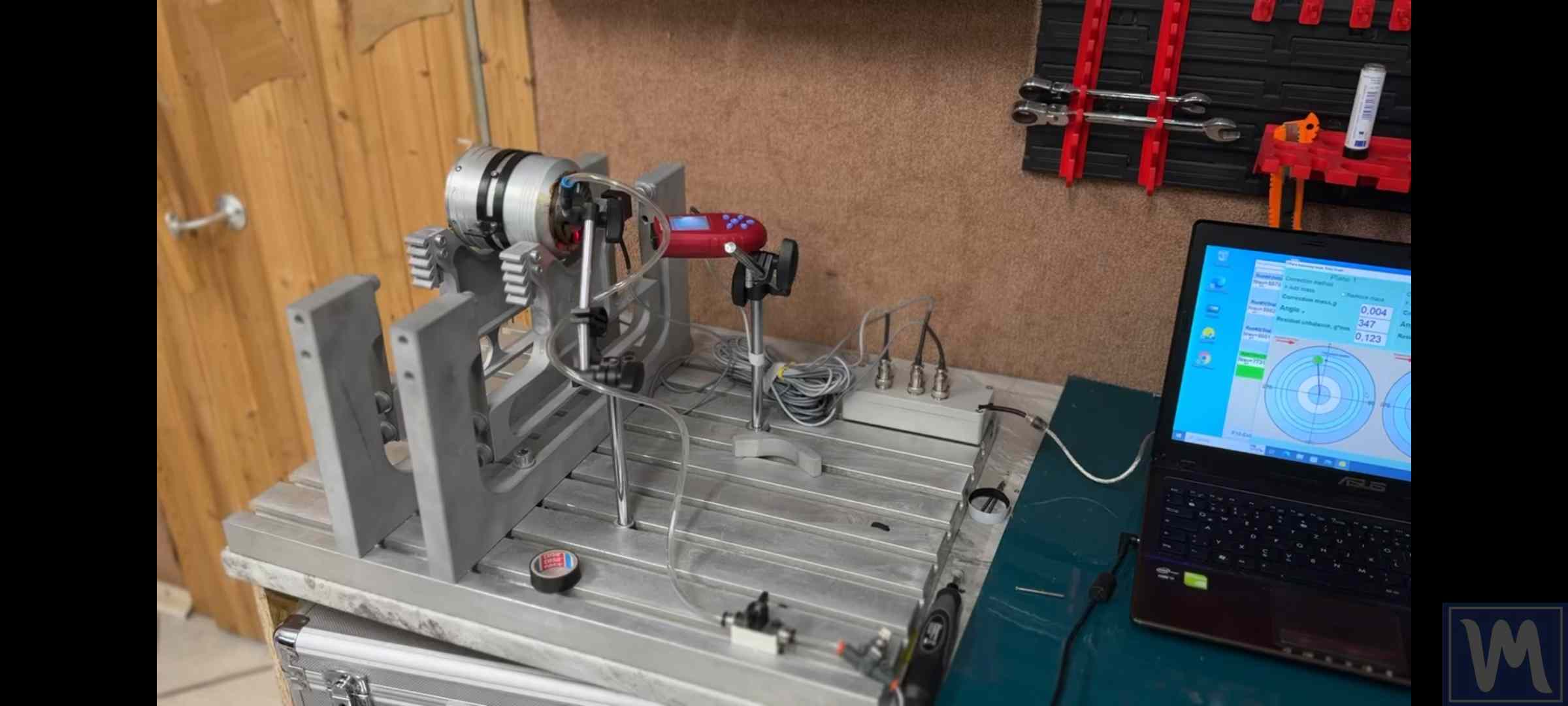 Steam turbine rotor on a balancing machine in a workshop